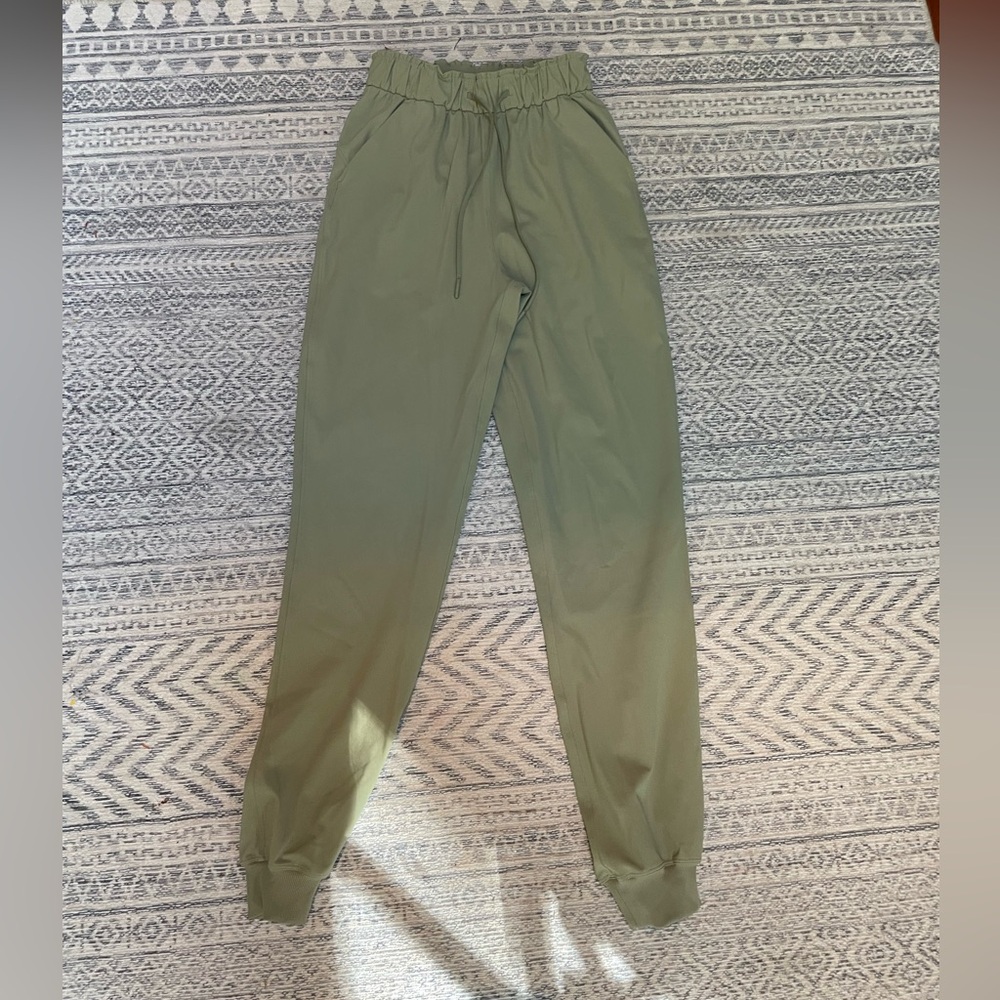 Size 2 Lululemon light green studio pants/joggers
